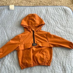 Burnt orange windbreaker